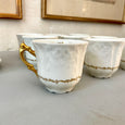 Ensemble de 9 tasses et sous-tasses en porcelaine blanche et dorée Lafarge