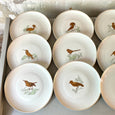 Lot de 12 assiettes en porcelaine Bernardaud "Les oiseaux d'or"