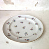Assiette à dessert en porcelaine de Limoges décor fleurs