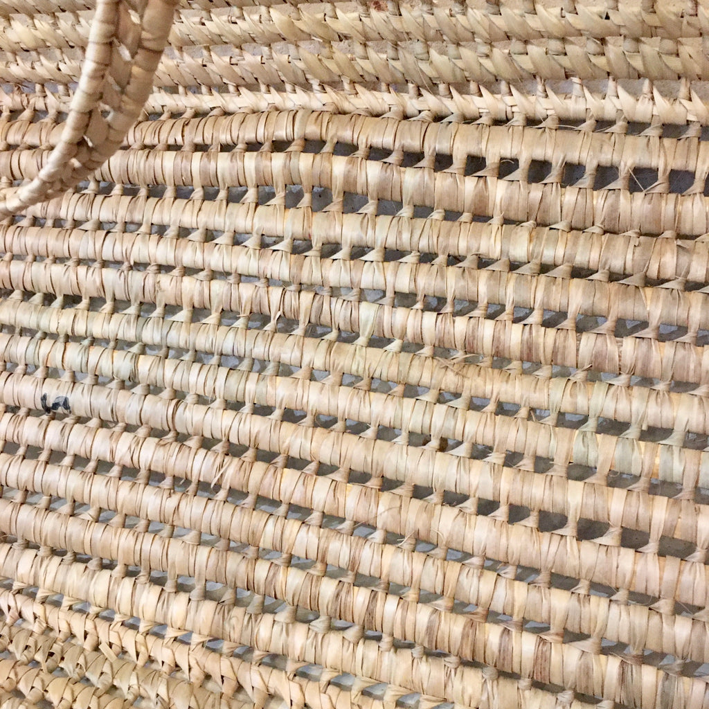 Couffin bébé en feuilles de palme tressées