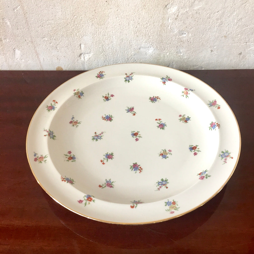 Plat rond en porcelaine de Limoges décor fleurs