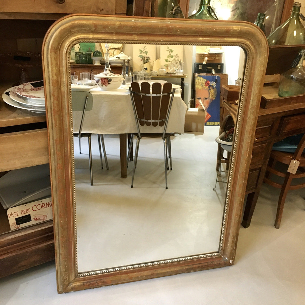 Grand miroir Louis Philippe doré fleurs gravées
